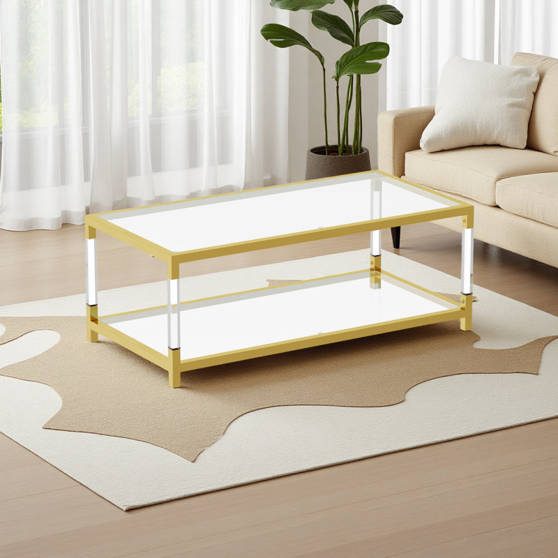 Table basse moderne à pieds en acrylique avec plateau en verre trempé
