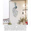 Décoration murale en métal représentant un paon gracieux, idéale pour une entrée, une terrasse ou une salle à manger.