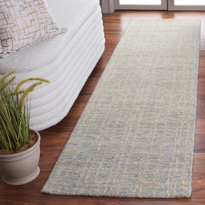 Tapis géométrique beige / bleu en jute de laine touffeté à la main Alvonia