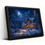 Tableau mural sur toile représentant un chalet enneigé avec de la fumée de cheminée et une décoration d'Halloween-694058503