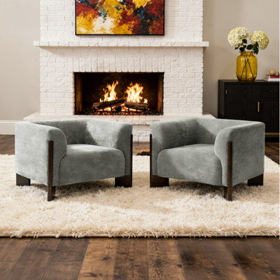 Fauteuil rembourré en chenille gris avec accoudoirs incurvés et pieds en bois massif