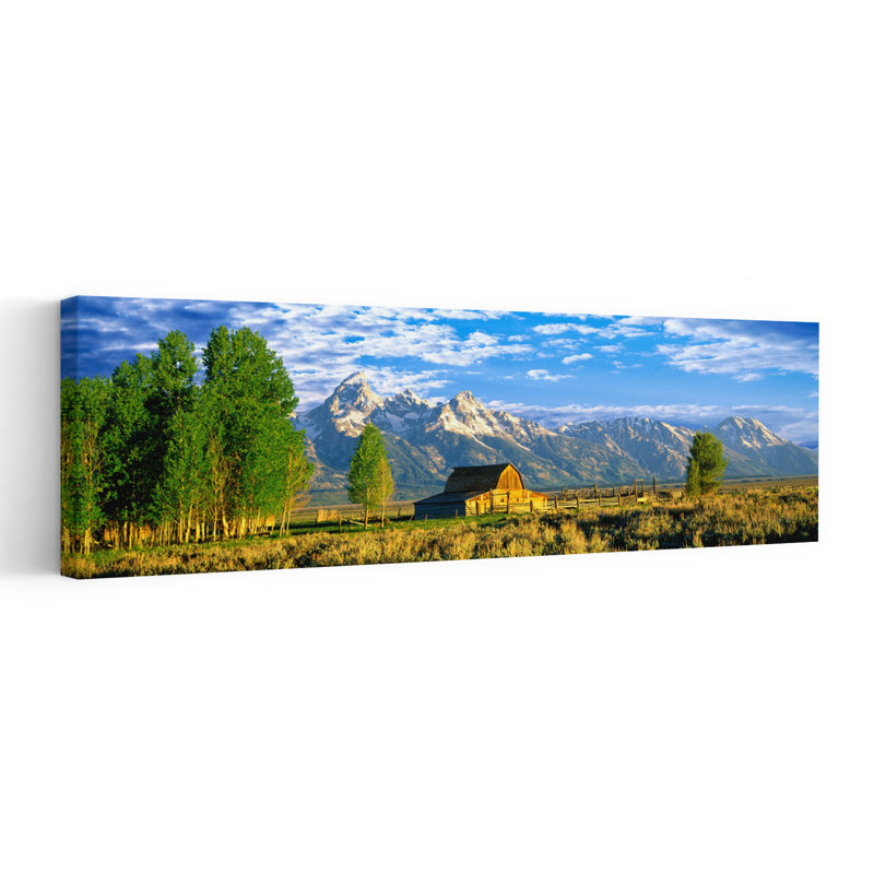 Sunrise Over The Moulton Barn Along Mormon Row Teton Range Mormon Row Historic District Grand Teton National Park Wyoming USA by Leo L. Larson - Wrapped Canvas Panoramic Print