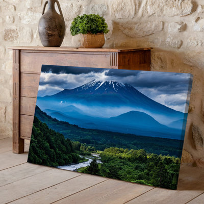 Canvas A Majestic Mountain Rises Dramatically Against A Backdrop Of Swirling Wall Art Dark Clouds Its Peak Capped With Snow Glistening Canvas Wall Art