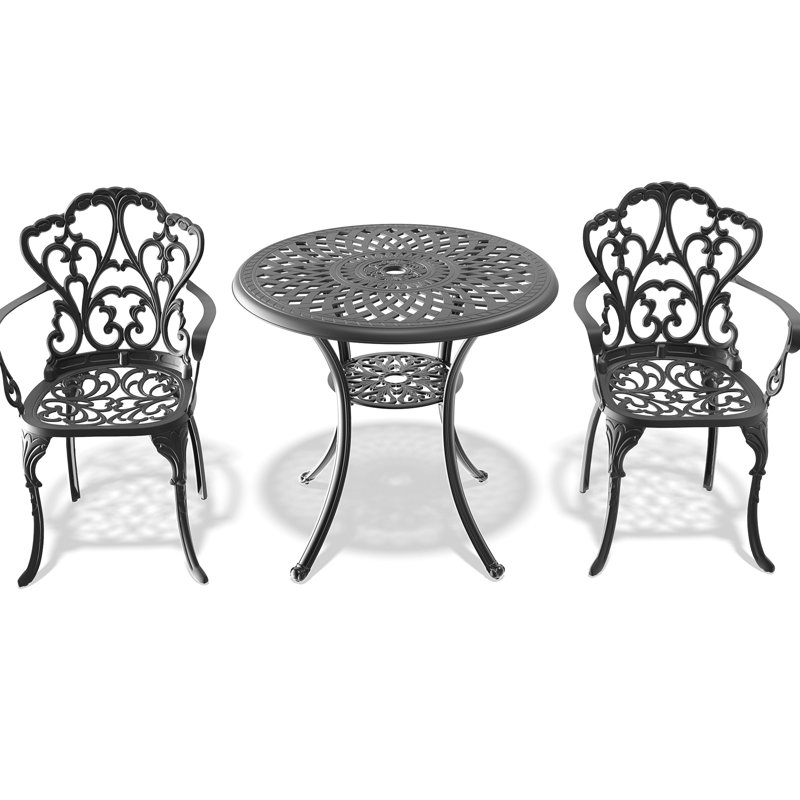 Table et chaises de patio noires en fonte d'aluminium avec coussins en tissu de couleur rouille