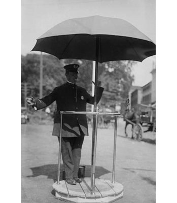 " Policeman Directs Traffic From Underneath An Umbrella In Newport Rhode Island "