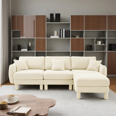 Canapé modulaire en L convertible 3 places avec accoudoirs en forme de coquillage et repose-pieds amovible Boucle