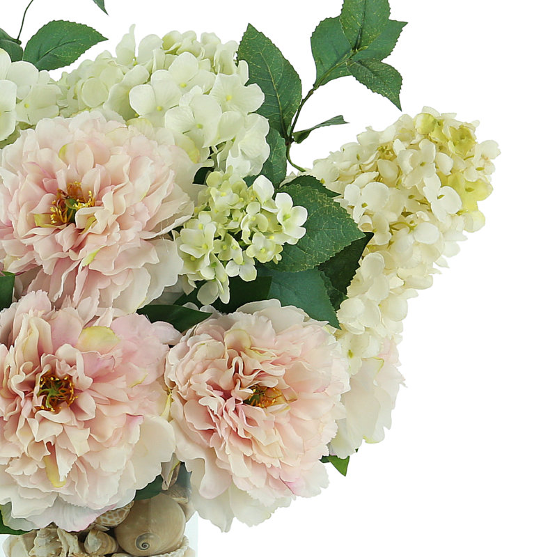 Peony and Hydrangea Arrangement in a Clear Glass Pot with Seashell