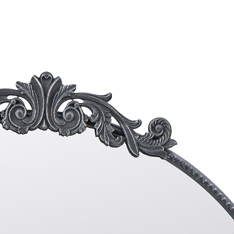 Miroir avec forme ronde et cadre d'inspiration baroque