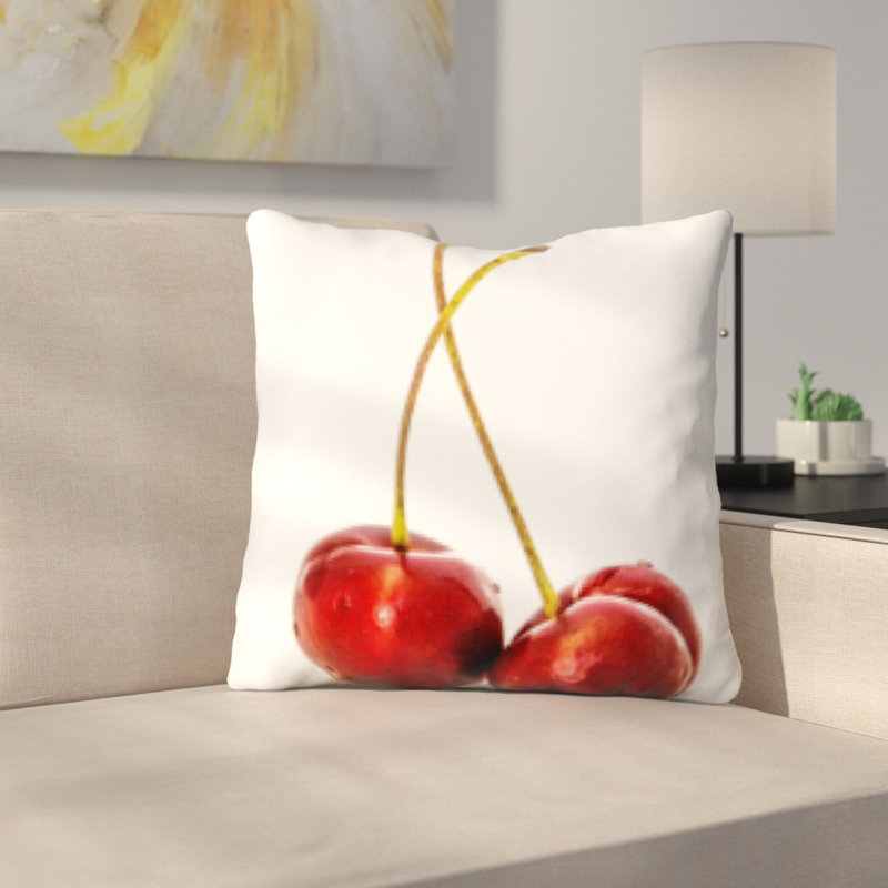 Coussin décoratif betances fruits cerise sur un fond blanc