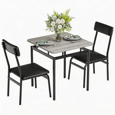Ensemble de salle à manger 3 pièces, table et chaises pour 2 personnes avec 2 chaises rembourrées en PU, style industriel avec structure en métal, idéal pour les petits espaces, salle à manger, appartement, studio, noir et gris.