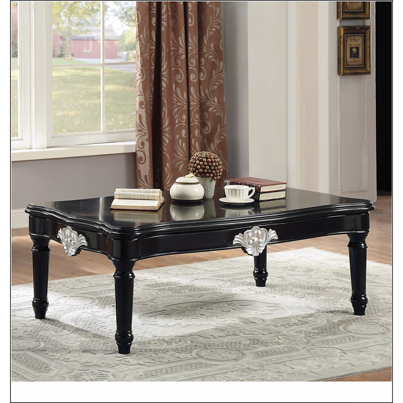 Table basse noire avec pieds tournés