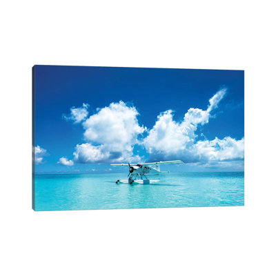 " Sea Plane Resting On Turquoise Island Water " by James Vodicka