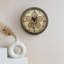 Ormiston Living Room Round Wall Clock with Metal Frame, Glass Front Gear Wall Clock-407301582