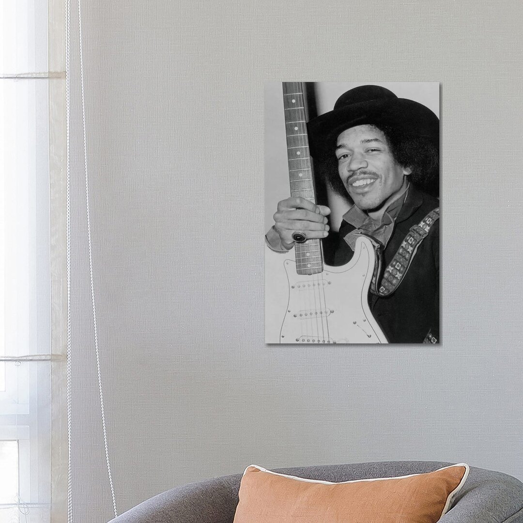 Leinwandbild A Smiling Jimi Hendrix Holding His Guitar von Radio Days