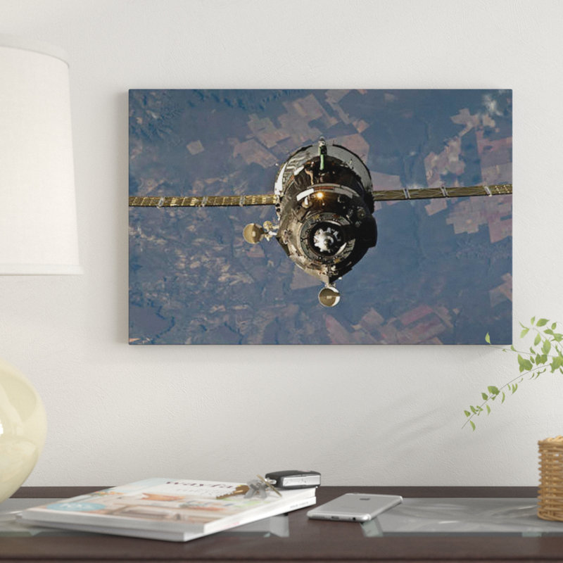 " The Soyuz TMA-19 Spacecraft " by Stocktrek Images, 18" H x 26" W x 1.5" D, Black Framed Canvas, No Mat