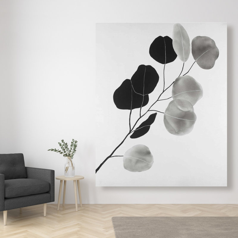Branche en niveaux de gris avec des feuilles de forme ronde - décor de toile blanche
