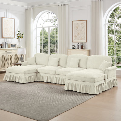 Canapé modulaire classique en U modulaire à 4 places avec accoudoirs évasés et volants amovibles, jupes plissées et pieds fuselés, canapé en nuage à assise profonde en chenille avec repose-pieds mobiles, blanc beige