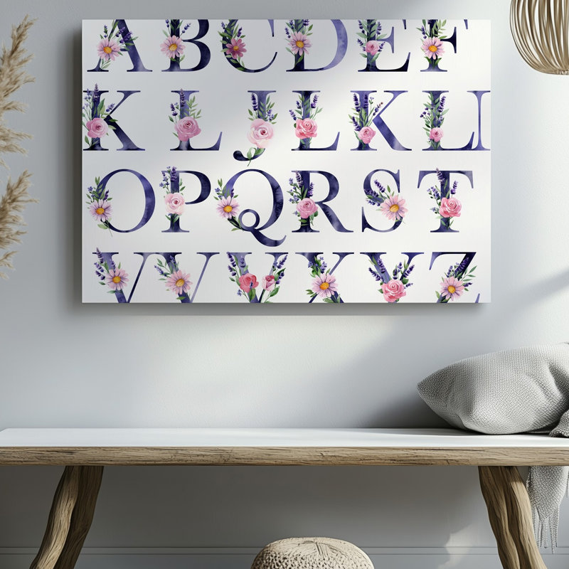 Toile, une grille méticuleusement disposée, affiche les lettres majuscules A à Z, chaque lettre est subtilement ornée d'une aquarelle