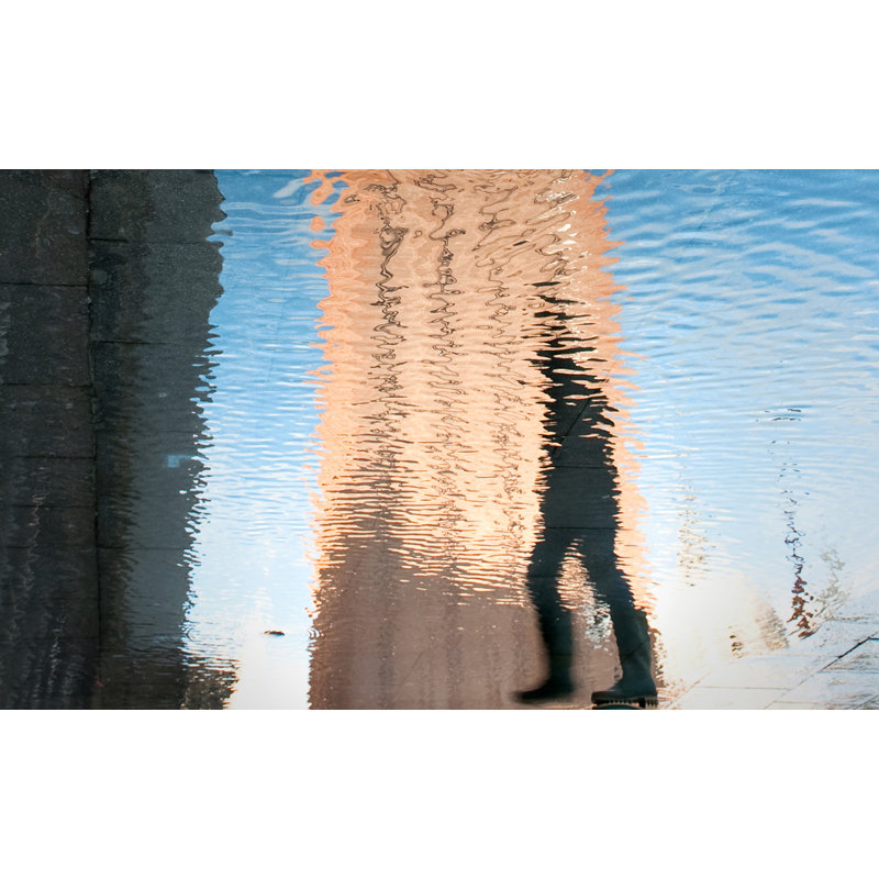 Puddle Walker Acrylic Print by Lillian August