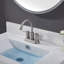 Robinet de salle de bain central à 2 poignées avec bonde