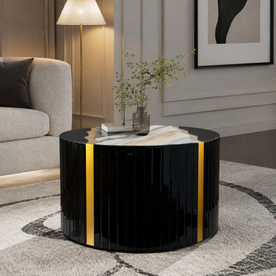 Table basse ronde noire et dorée