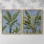 Reproduction encadrée de feuilles de bananier sur fond bleu I-Premium - prêt à être accroché - aucun clou requis - aucun clou requis-738311800-738311801
