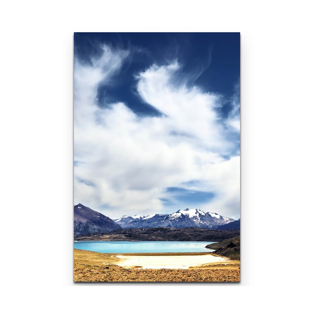 Leinwandbild Blauer See zwischen schneebedeckten Bergen