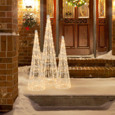 Petit arbre de Noël avec étoiles décoratives illuminées