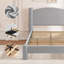Structure de lit plateforme simple rembourrée en coton gris avec pieds de colonne arrondis, tête de lit rembourrée et support de lattes de matelas pour chambre dortoir