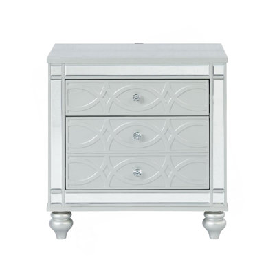 Stylish Silver Metallic Nightstand With Two Drawers And Elegant Fret Work Detail, Perfect For Modern Bedrooms.