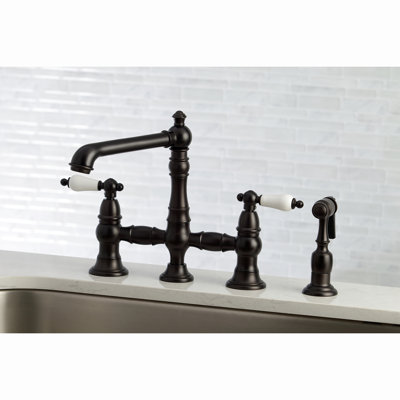 Kingston Brass English Country Two-Handle 4-Hole Deck Mount Bridge Kitchen Faucet with Brass Side Sprayer