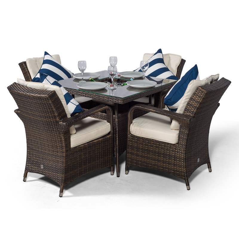 Karas 4 - Person Wicker Patio Dining Set with Square Table , Cushions Included, Brown