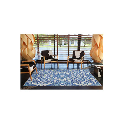 Tapis rond bleu à motif de losanges lavables