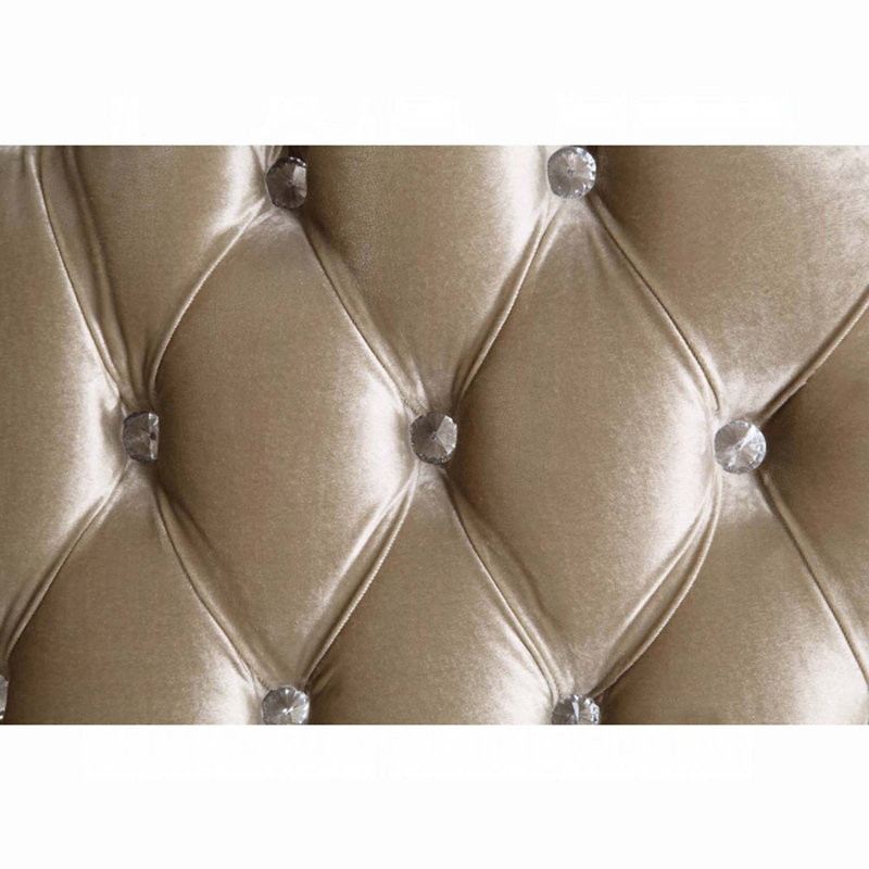 Antique White Tufted Sofa with Floral Cushions and Nailhead Trim