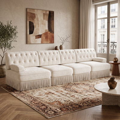 Canapé d'angle modulaire 4 places, jupe à franges d'inspiration vintage, dossier capitonné et assise flexible, beige