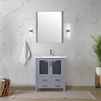 Meuble-lavabo gris foncé de 76 cm de large et 46 cm de profondeur, comptoir en céramique blanche, miroir biseauté fixe de 71 cm de haut, fermeture amortie, deux tiroirs et un placard pour salle de bain, fermeture rectangulaire.