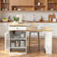 Îlot de cuisine avec table de salle à manger extensible, rangement double face, 2 tiroirs, prise de courant et tablettes latérales ouvertes