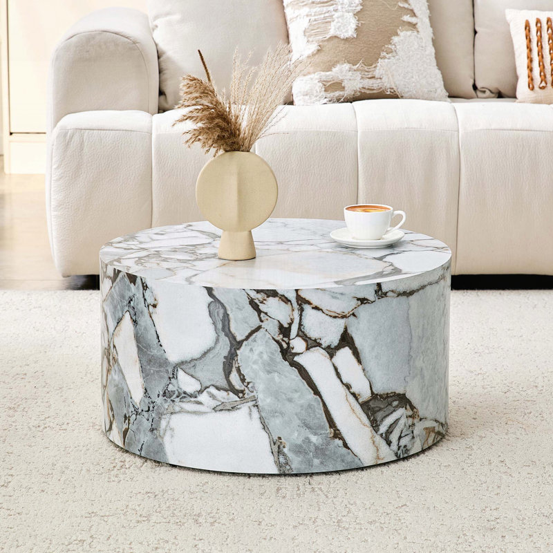 Table basse cylindrique texturée en marbre blanc
