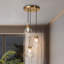 Suspension en verre doré en forme de larme à 3 lumières