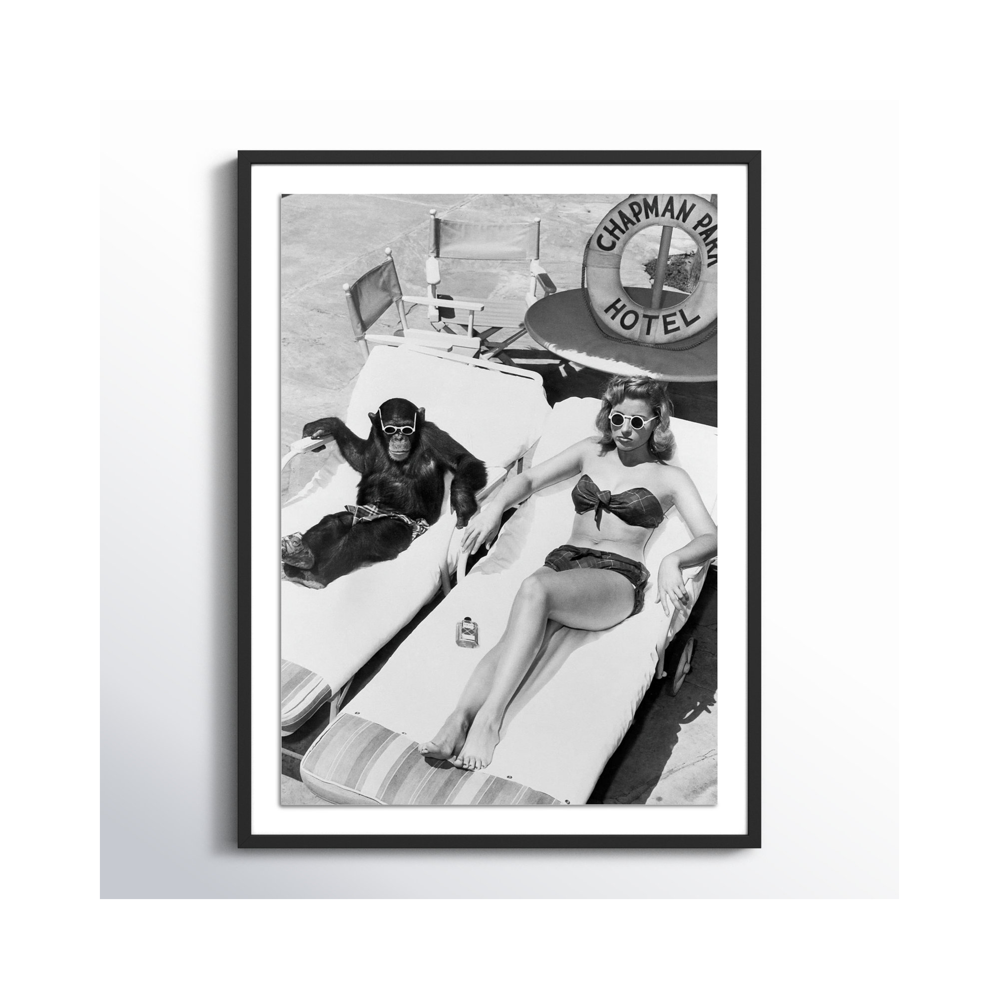 Woman Sunbathing With Chimpanzee by Getty Images, Black Maple Framed, 32" H x 24" W