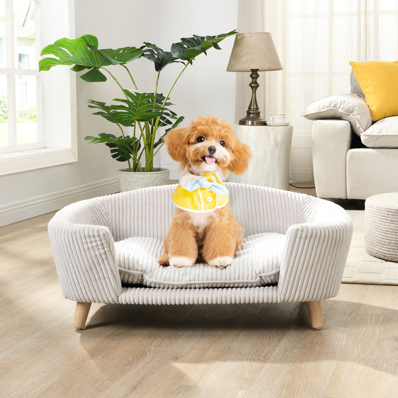 Petit cadre de lit pour chien avec un matériau en velours côtelé, des pieds en bois d'hévéa, de la mousse de soutien, une teinte beige, un assemblage sans effort pour une détente confortable