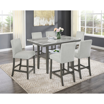Ensemble de salle à manger 7 pièces à hauteur de comptoir avec plateau en faux marbre, chaises rembourrées et tablette de rangement intégrée pour les espaces de vie modernes.