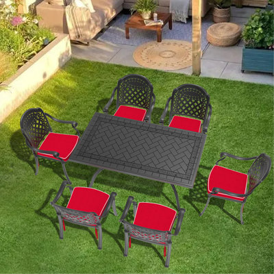 7-Piece Set Of Cast Aluminum Patio Furniture With Black Frame And Red Seat Cushions