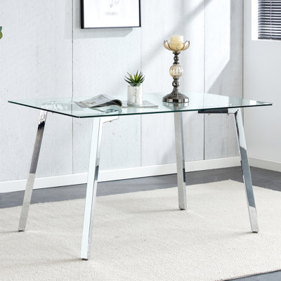 Table de salle à manger rectangulaire avec plateau en verre trempé et pieds en métal doré, style minimaliste moderne pour la décoration intérieure