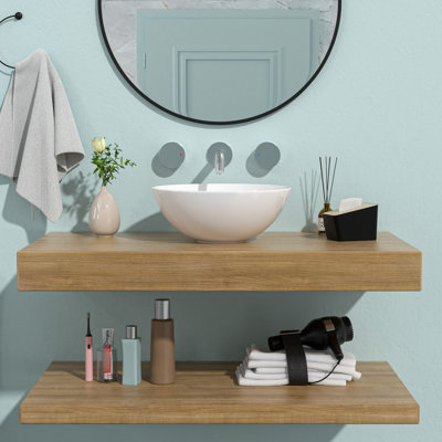 Lavabo de salle de bain rond en céramique 16 po x 16 po blanc. Contemporain. Qualité supérieure, faible absorption d'eau. Surface lisse, résistance aux taches. Installation au-dessus du comptoir. Trou de drain central de 1 3/4 po