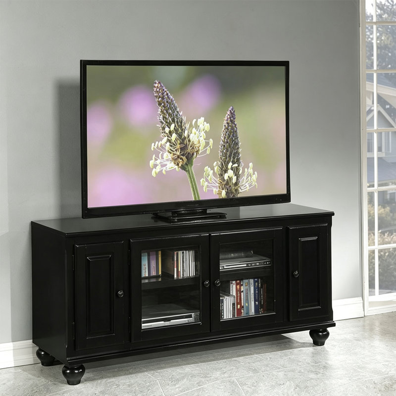 Meuble télé en bois noir avec placards de rangement fermés en verre et panneaux pleins