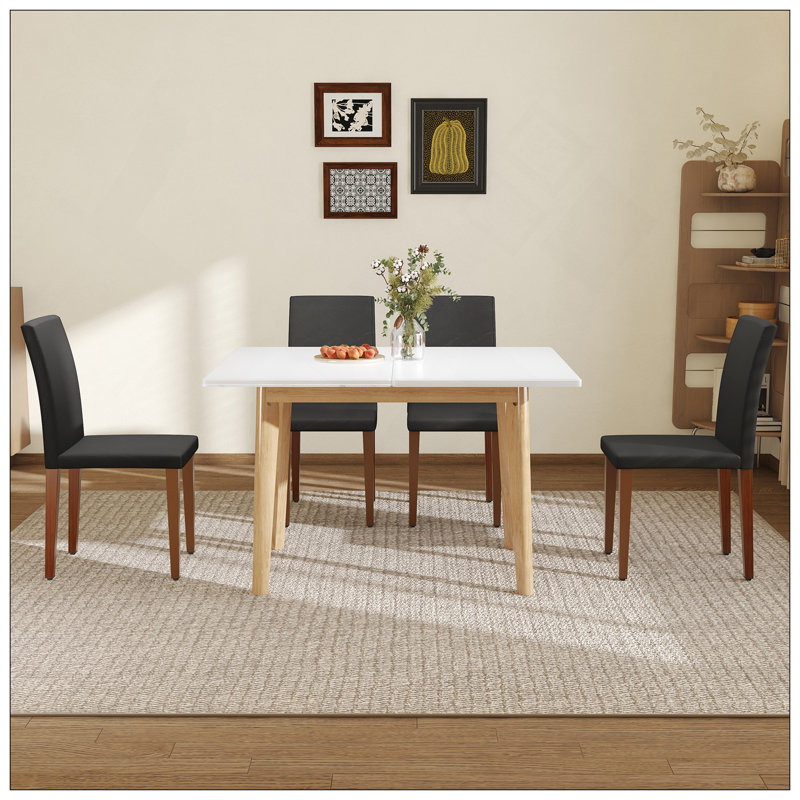 Ensemble de table et de chaises. Plateau de table en pierre frittée blanche, pieds en bois d'hévéa, bureau d'ordinateur pliable, bureau pliable. Comprend 4 chaises de salle à manger en polyuréthane noir avec pieds en métal de couleur noyer.