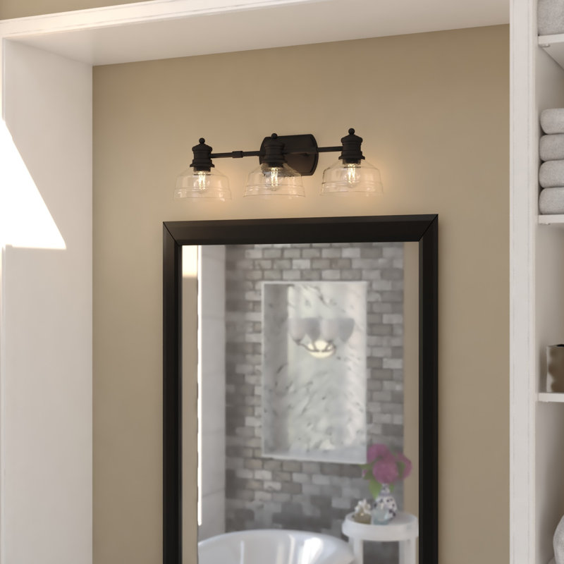 Adakia 3-Light 25.5 In. Wide Matte Black Farmhouse Bathroom Vanity Lighting Fixture, Clear Seeded Glass Shade, Dimmable, LED Compatible, Reversible Over The Mirror Mounted Steel Wall Sconce