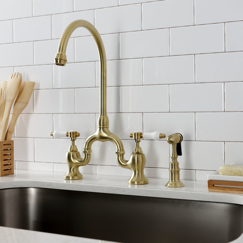Kingston Brass Bel-Air Two-Handle 3-Hole Deck Mount Bridge Kitchen Faucet with Brass Side Sprayer, Brushed Brass