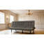 Canapé futon gris foncé avec capitonnage biscuit et appui-tête réglable, convertible en méridienne ou en lit pour un confort polyvalent